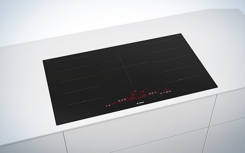 Bosch BenchmarkÂ® Series 36 Inch Wide 5 Burner Induction Cooktop built into a countertop