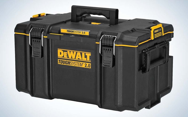 A durably built black toolbox with clasps holding it closed and the word "DeWalt" on the front.