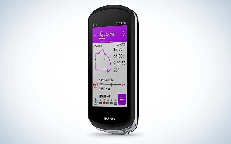 A black Garmin Edge 1040 Solar GPS Bike Computer displaying the distance, time, route, and more of a bike ride.